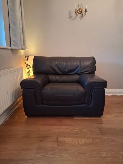 Leather armchair with matching footstool