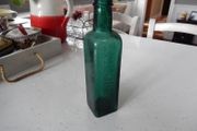 Vintage Coloured Glass Embossed Bottle