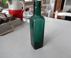 Vintage Coloured Glass Embossed Bottle
