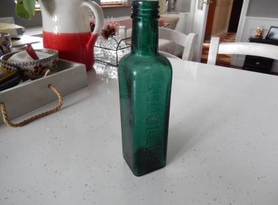 Vintage Coloured Glass Embossed Bottle