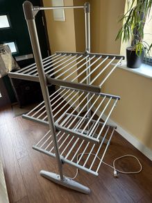 Heated clothes drying rack