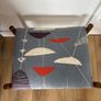 Mid Century Style Wooden Footstool / Ottoman with retro atomic-inspired upholstered seat. Image 3