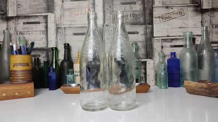 363 - Set of 2 Vintage Collectible Decorative Clear Glass Embossed Letters L Rose and Co Ltd Bottles