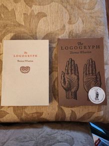 The Logogryph. By Thomas Wharton. First Edition Complete With Presentation Sleeve Paperback In Very Good Condition. 37