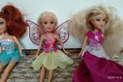 3 dolls with clothes