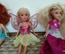 3 dolls with clothes
