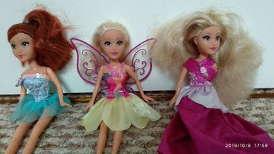 3 dolls with clothes