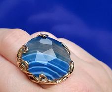 Adjustable ring with faceted blue Agate stone & gold plated setting