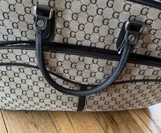wheeled suitcase bag with long handle and short carry handles