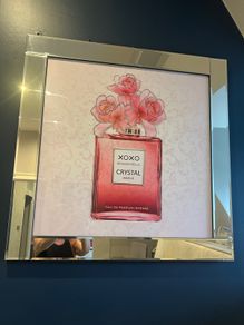 picture of perfume bottle in mirrored frame