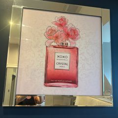 picture of perfume bottle in mirrored frame
