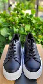 Black sneakers with thick white sole