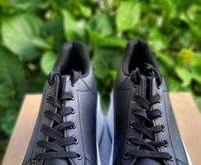Black sneakers with thick white sole