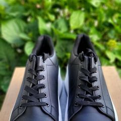 Black sneakers with thick white sole