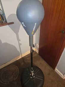 Punching bag stand with gloves