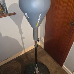 Punching bag stand with gloves