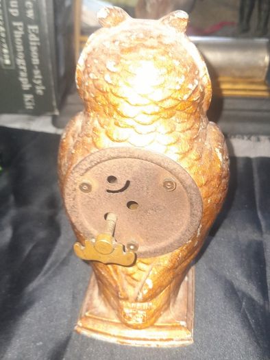 Cold Painted Bronze Clock In Form Of An Owl. The Decorative Dial Sits In The Owls Belly And Has Wind Up Movement,