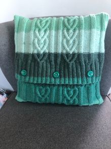 Hand knitted aran cushion cover