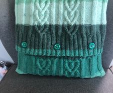 Hand knitted aran cushion cover