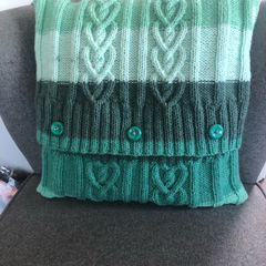 Hand knitted aran cushion cover