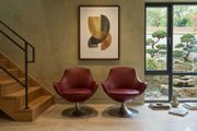 Pair of vintage red swivel egg chairs