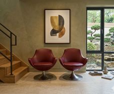 Pair of vintage red swivel egg chairs