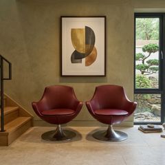 Pair of vintage red swivel egg chairs
