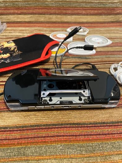 PSP  Console plus 10 games, charger and headphones