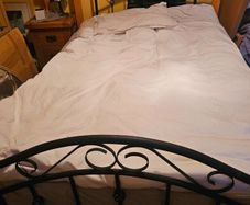 Standard size double bed. 4 foot 6 inches wide. Lo