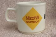 NIZORAL SHAMPOO (Janssen) - a scarce promotional mug made by Carrigdhoun Co-Op pottery of Carrigaline, County Cork (late 1980s)