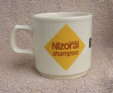NIZORAL SHAMPOO (Janssen) - a scarce promotional mug made by Carrigdhoun Co-Op pottery of Carrigaline, County Cork (late 1980s)