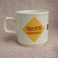 NIZORAL SHAMPOO (Janssen) - a scarce promotional mug made by Carrigdhoun Co-Op pottery of Carrigaline, County Cork (late 1980s)