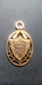 Antique 9ct rose gold school rugby shield pendant