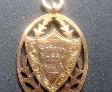 Antique 9ct rose gold school rugby shield pendant