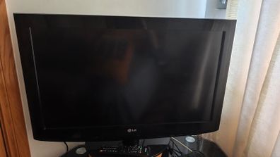 LG 32 inch Flat Screen TV with Stand plus DVD Player.