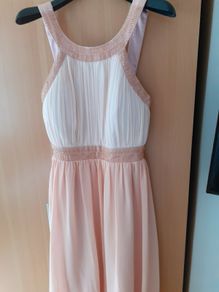 Occasional dress worn once and cleaned Slight emblishment on straps chest and waist .Slightly padded at bust so no need for a bra ..Knee length .25 euro paid 95 .