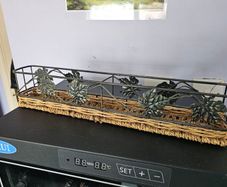 Decorative metal and wicker tray in good condition.