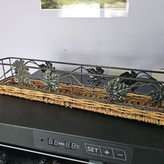 Decorative metal and wicker tray in good condition.