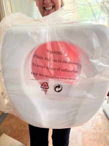Toilet seat raiser. New. In packaging.