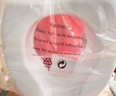 Toilet seat raiser. New. In packaging.