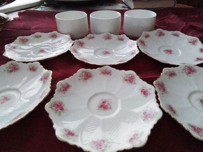 Six Pretty China Saucers