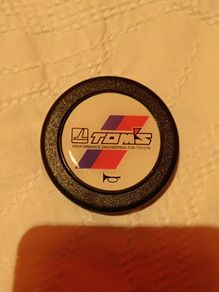 Genuine vintage TOM'S horn button for Toyota steering components.