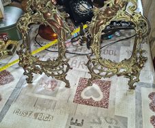 Beautiful Pair of Antique Art Nouveau Beatrice. Bronzed Photo Frames Cherub. a stunning lady lies on the top of the frame with beautiful scrollwork descending down the frame to a winged Cupid or Angel