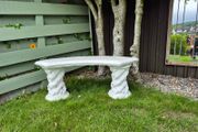 Cast stone curved garden bench