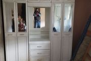 Double bedroom wardrobe with drawers and mirror in-between wardrobes and plenty of storage above