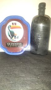 vintage muc bottle and Guinness tray