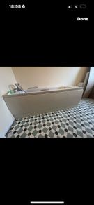 Bath with Bath panels and taps