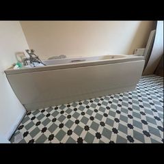 Bath with Bath panels and taps