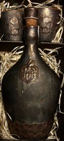 ceramic bottle carafe with cork with two glasses
