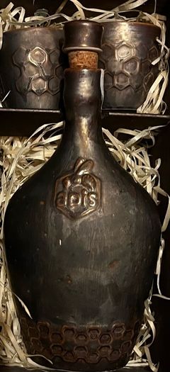 ceramic bottle carafe with cork with two glasses